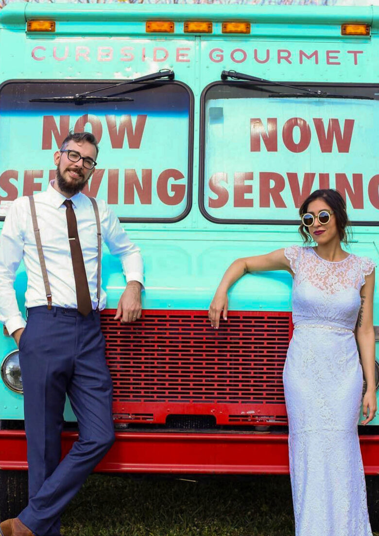 Couple getting married in front of Curbside Gourmet's food truck
